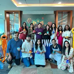 A wonderful team photo from our Diwali pot painting workshop. These custom-decorated pots make for a great, personalized office decoration.