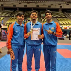 Champions together. Jitendra Kumar celebrating his gold medal win with his teammates at the South Asian Karate Championship.