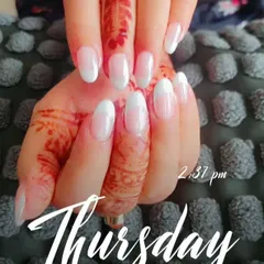 Another view of the classic French manicure, showing how the clean lines stand out against the detailed henna design.