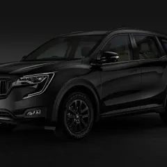 A studio shot of the 2024 Mahindra XUV700 in a striking all-black finish. I used subtle lighting to sculpt the car's form and create a powerful, moody atmosphere.
