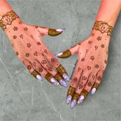 This scattered floral booti design is a favorite among guests. The small, delicate flowers give a sprinkle of tradition, while the lotus cuff adds a touch of elegance.