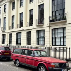 A vintage red Volvo against the classic architecture of London. I'm always looking for these cinematic moments and color stories during my travels.