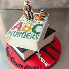 Here's another angle of our Agatha Christie book cake, showing the "Happy Double First Birthday" message. We can personalize any design to fit your unique celebration.