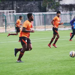A player dribbles forward during a practice game. We believe that football doesn't build character, it reveals it.