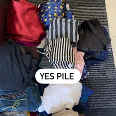The "Yes Pile"! These are the pieces that fit you well, match your personal style, and make you feel confident. We build the foundation of your new wardrobe from here.