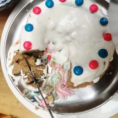 The moment of truth. The piñata cake is cut, revealing a cascade of colorful surprises inside. This was a triumphant and delicious end to a project driven entirely by the children's own initiative.