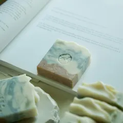 This is my Lavender, Rosemary & Peppermint bar, a skin-loving powerhouse enriched with indigo powder, hibiscus powder, and kaolin clay. And yes, there’s a tiny dolphin swimming in there.
