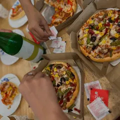 An overhead shot of our favorite community fuel: pizza. These informal gatherings are where friendships are formed and our tribe grows stronger.