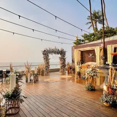 Here is a wider angle of the beachside proposal decor, showing how the entire deck space was transformed. I used string lights, candles, and floral arrangements to create a warm and inviting ambiance as the sun set.
