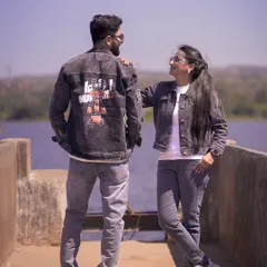 A stylish shot of a couple in matching denim jackets by the lake. This shows how we can do cool and modern pre-wedding photography.
