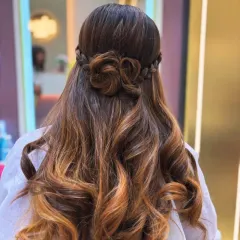 A closer look at this beautiful braided rose hairstyle. The detail in the braid work combined with the soft curls creates a romantic and sophisticated style.