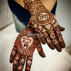 Another example of a baby shower design, with "Coming Soon" and "Boy" themes. I teach how to incorporate text and symbols effectively into your mehndi art.