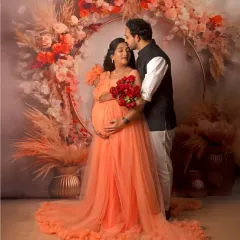 A beautiful portrait in our peach-colored gown, framed by the boho floral ring, showcasing its soft and romantic feel.