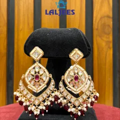 These elegant polki earrings with maroon drops are a versatile choice for any wedding guest or bridesmaid.