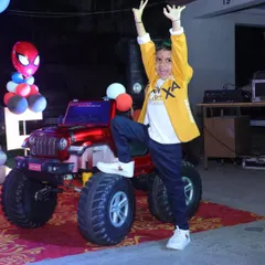 The birthday boy posing with his ride. The mini jeep for the grand entry was a perfect addition to his Spiderman themed party.