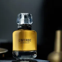 For the Givenchy L'Interdit perfume, the goal was to create a sense of classic, dark elegance. The styling is minimal, letting the golden liquid and the bottle's strong shape speak for themselves.