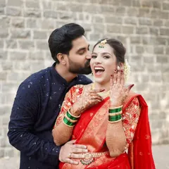 A playful kiss and a joyful reaction, this is the perfect capture of a happy engagement moment.