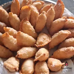 This is a picture of my first batch of Mawa Gujiyas for Holi. Every year, the demand for these traditional sweets is overwhelming, and it fills my heart with joy. Each one is handmade with a rich mawa filling, showing that some traditions, especially delicious ones, never go out of style.