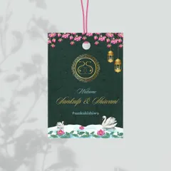 An exquisite luggage tag designed with an Indian lotus and swan theme. The rich green background and gold foil details make for a luxurious and practical favor for guests at a destination wedding.