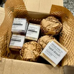 A look inside one of our packages, showing how we use honeycomb wrap to protect fragile items like our body polishes in glass jars. This is a sustainable alternative to bubble wrap.