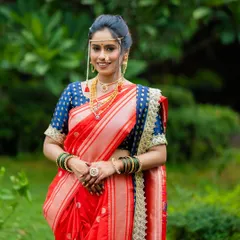 A classic Maharashtrian bride in a radiant red Paithani Nauvari. I styled this entire look, from the precise drape and minimal makeup to the traditional mundavalya and jewelry, ensuring she felt both royal and comfortable on her big day.