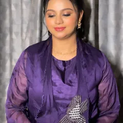 A serene shot with eyes closed, showcasing the delicate eyeshadow work.