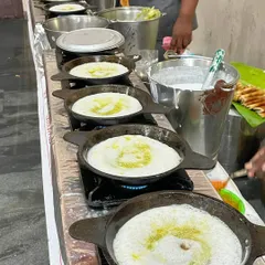 Our live dosa counter is always a crowd favorite. Watch as our chefs expertly prepare hot, crispy dosas, drizzled with our special Mayyas ghee, served fresh off the tawa right onto your guests' plates.