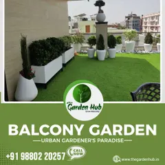 A perfect example of an urban gardener's paradise. This rooftop garden combines a lush artificial lawn with a variety of plants in modern white planters, creating a clean and green escape.