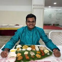 A happy guest enjoying our complete banana leaf spread. It’s a moment of pure satisfaction that we strive to create at every event.