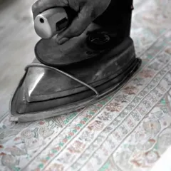 From the heat of the iron to the sharpness of the scissor, every element shapes the legacy of my regal artistry. Here, a finely embroidered fabric is being prepared for its final form.