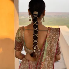 A close up of the ribbon wrapped braid. This is a simple yet very effective way to add a unique touch to a bridal hairstyle.