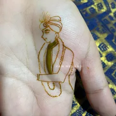 For a truly personal touch, I can create a minimalist portrait of the groom. This is a simple yet elegant design, perfect for the groom who wants something unique and artistic on his palm.