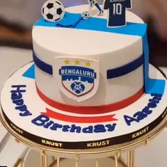 A special custom cake for a Bengaluru FC football fan. The design incorporates the team's logo and colours, along with a personalized jersey and name, making it a truly unique celebration cake for a football lover.