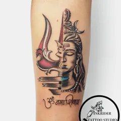We specialize in transformative cover-ups, like this powerful Mahadev piece. We worked with the client to completely hide an old tattoo with a design that represents strength and divinity, combining detailed portrait work with the iconic Trishul and Om Namah Shivay script.
