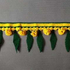 A simple and elegant toran design featuring yellow crochet flowers and green mango leaves. This door hanging is perfect for adding a subtle festive touch to your home entrance any time of the year.