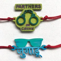 For the partners in crime. These fun, hand-painted rakhis feature playful Hindi and English phrases like 'Jugaadu' and 'Partners in Crime', perfect for siblings with a great sense of humour.