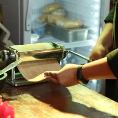 Our live pasta station is an immersive experience. We bring the heart of an Italian kitchen to your event, with our chefs rolling fresh pasta dough by hand, demonstrating the craft and ensuring every plate is made to order.