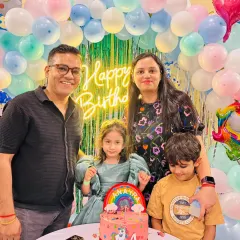 A beautiful family photo in front of our pastel balloon backdrop. Creating these picture-perfect moments is part of the magic.