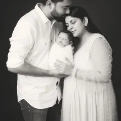 A classic black and white family portrait that becomes an instant heirloom. In this quiet, timeless frame, all that matters is the connection between new parents and their precious baby. This is the kind of powerful, emotive photography I create to tell your family's story for generations.