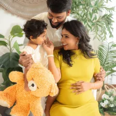 A complete family, glowing with love and anticipation. This portrait from a maternity session beautifully includes the father and older sibling, telling the story of a family growing together.