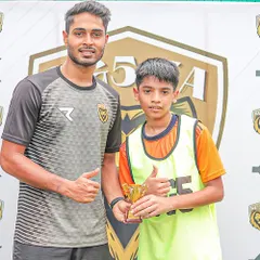 A coach presents a Player of the Match award, a regular feature in our tournaments to acknowledge game-changing contributions.