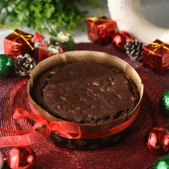 My Christmas Special Plum Cake, rich with fruits and nuts and soaked in rum (or orange juice for a non-alcoholic version). It comes beautifully wrapped, ready for holiday gifting.
