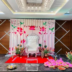 For a traditional Seemantham, we created this elegant stage with an ornate white throne chair for the mother-to-be. The backdrop, adorned with lotus and hummingbird motifs and framed by fresh tuberose garlands, sets a serene and sacred tone for the ceremony.