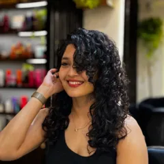 It was an absolute pleasure giving the talented actress Ritika Singh a curly makeover. We went for a cut that added shape and volume, styling it to create these soft, defined curls that perfectly frame her face.