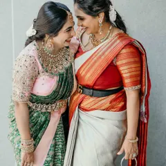 There is nothing more rewarding than seeing my creations become part of cherished family moments. Here, two sisters radiate joy, one in a custom-designed half-saree that blends tradition with a modern twist.