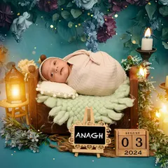 A newborn rests in a basket in a mystical, candlelit forest setting. This creative newborn setup uses deep colors and soft lighting to create a magical, fairy-tale feel.