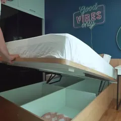 We build beds that do more than just look good. This modular bed features a powerful gas pump lift-up mechanism, revealing a large, sectioned storage space underneath, perfect for stowing away extra bedding and seasonal items in Mumbai homes.