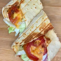 My Saucy Paneer Wrap is both crunchy and spicy. It's filled with crispy coated paneer, fresh lettuce, tomatoes, and a generous amount of tandoori mayonnaise, all wrapped in a soft, grilled tortilla.