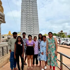 A group photo in front of the towering gopuram of the Murudeshwar temple. My coastal trips often include visits to iconic cultural landmarks like this.