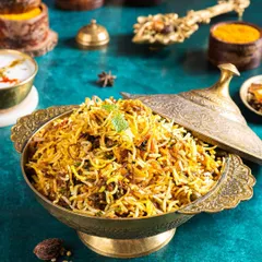 A majestic bowl of biryani, styled in traditional brassware. I used spices and herbs as props to tell the story of the dish's rich flavours and aromatic ingredients.